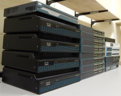 Modern Cisco equipment lined up on a table